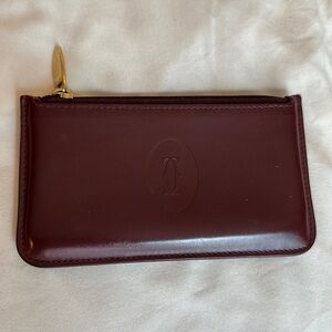 Cartier card holder/ change purse with zipper in burgundy color